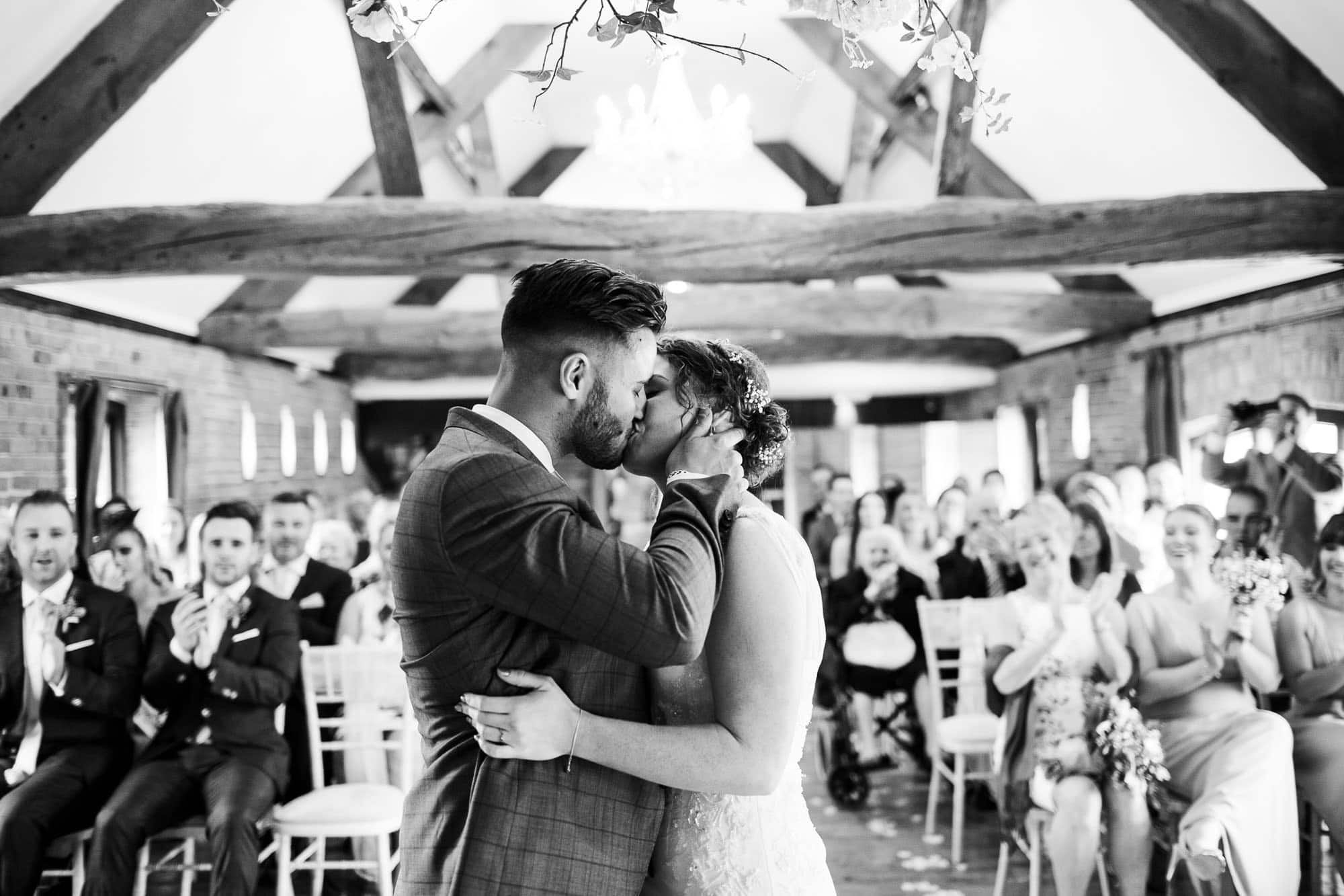 Wedding photography at Swancar Farm - first kiss