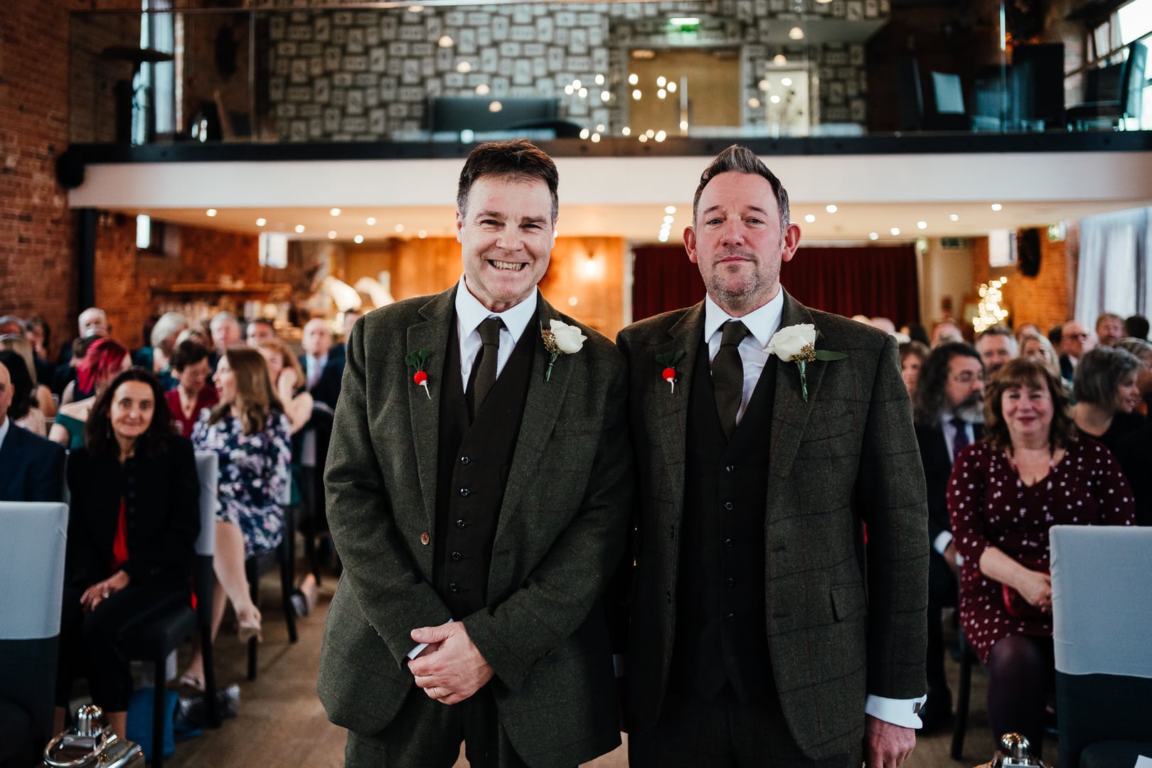 Groom and best man at The Carriage Hall for their Christmas wedding. Both wearing embroidered radishes on their lapels in reference to Withal and I