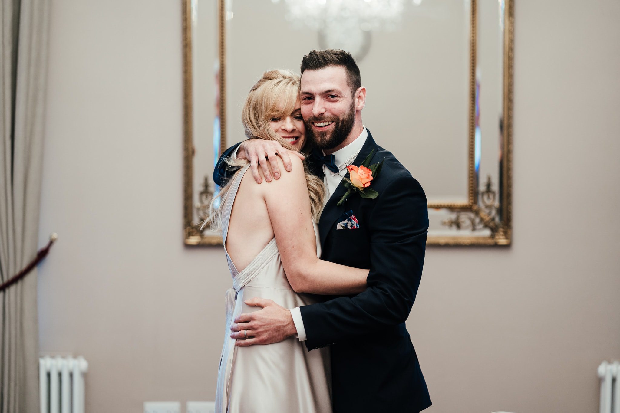 Bridgford Hall wedding photography - bride nd groom embrace after just getting married in west bridgforrd
