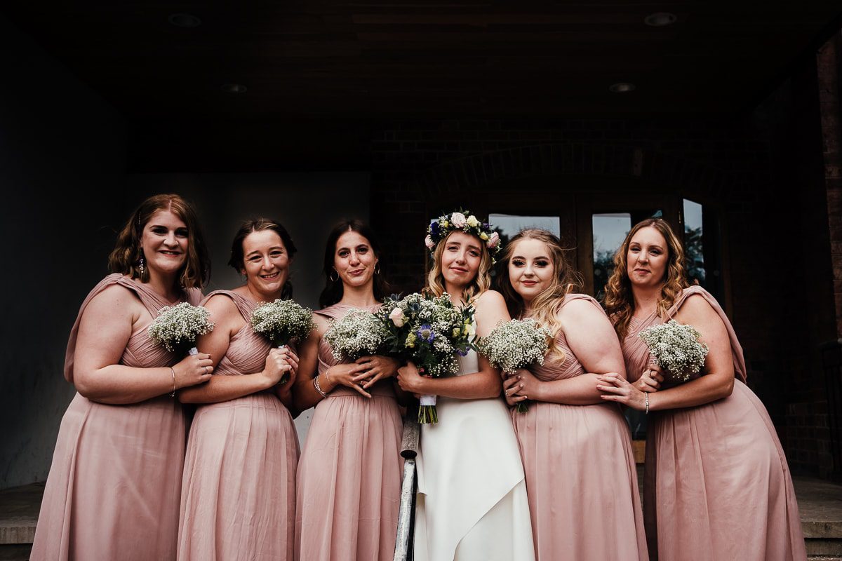 Bride and bridesmaids outside Bridgford hall