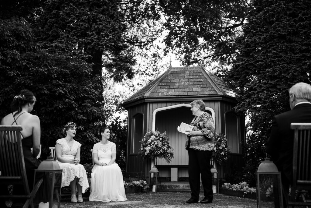 Wedding photography at Thorpe Garden. Black and white photo of ceremony/blessing
