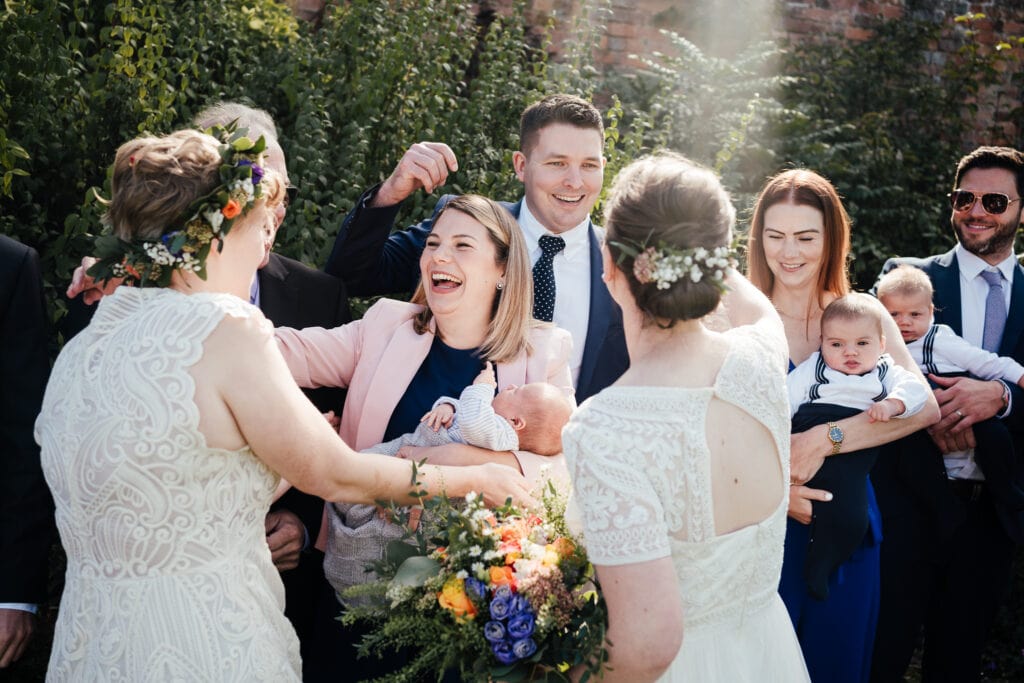 Brides greeting guests.