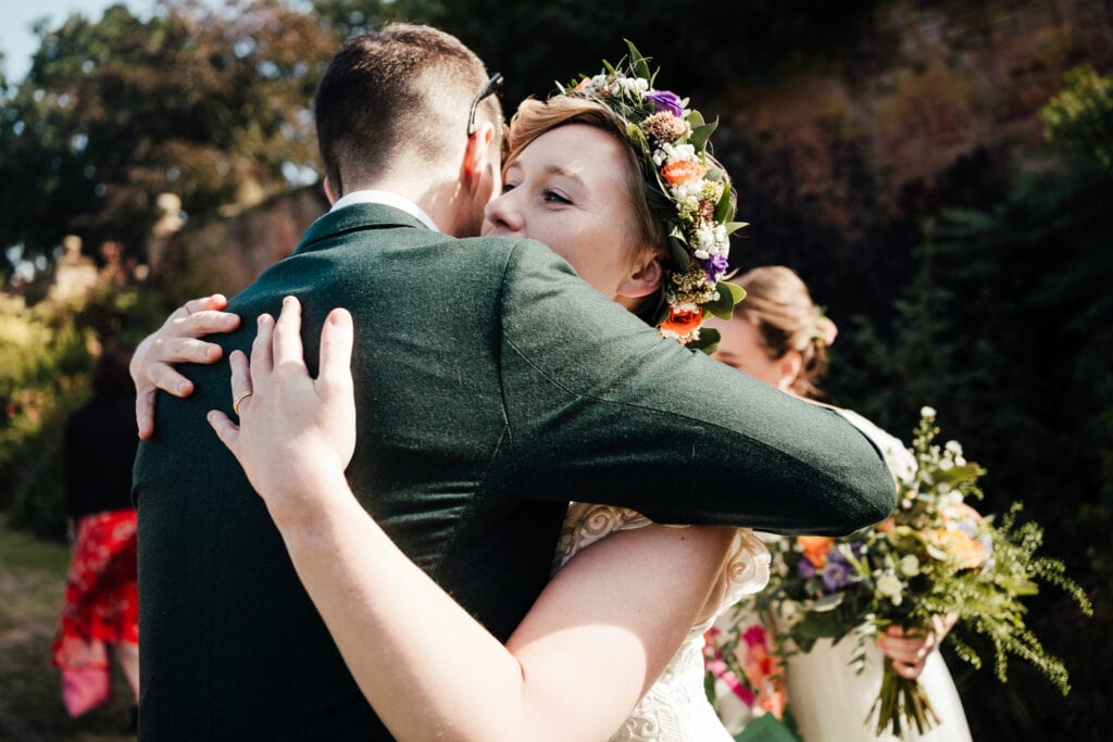 Bride hugging guest