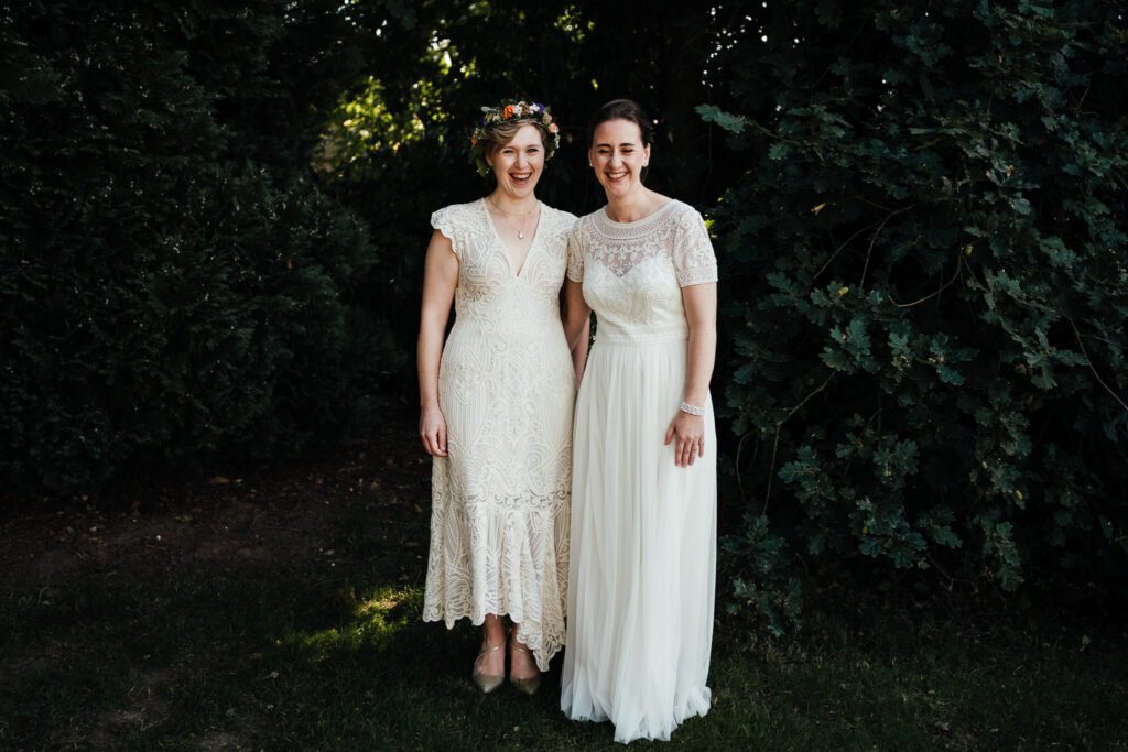 Wedding photography at Thorpe Garden. Brides laughing