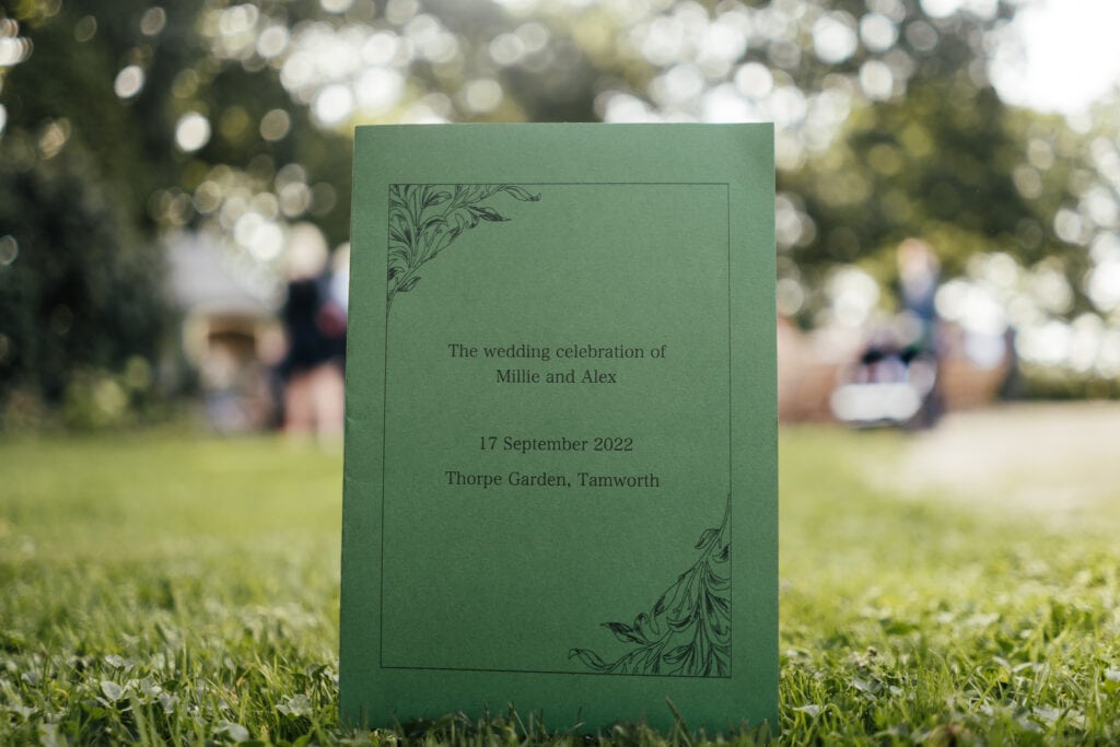 Close up of Wedding stationery in grass