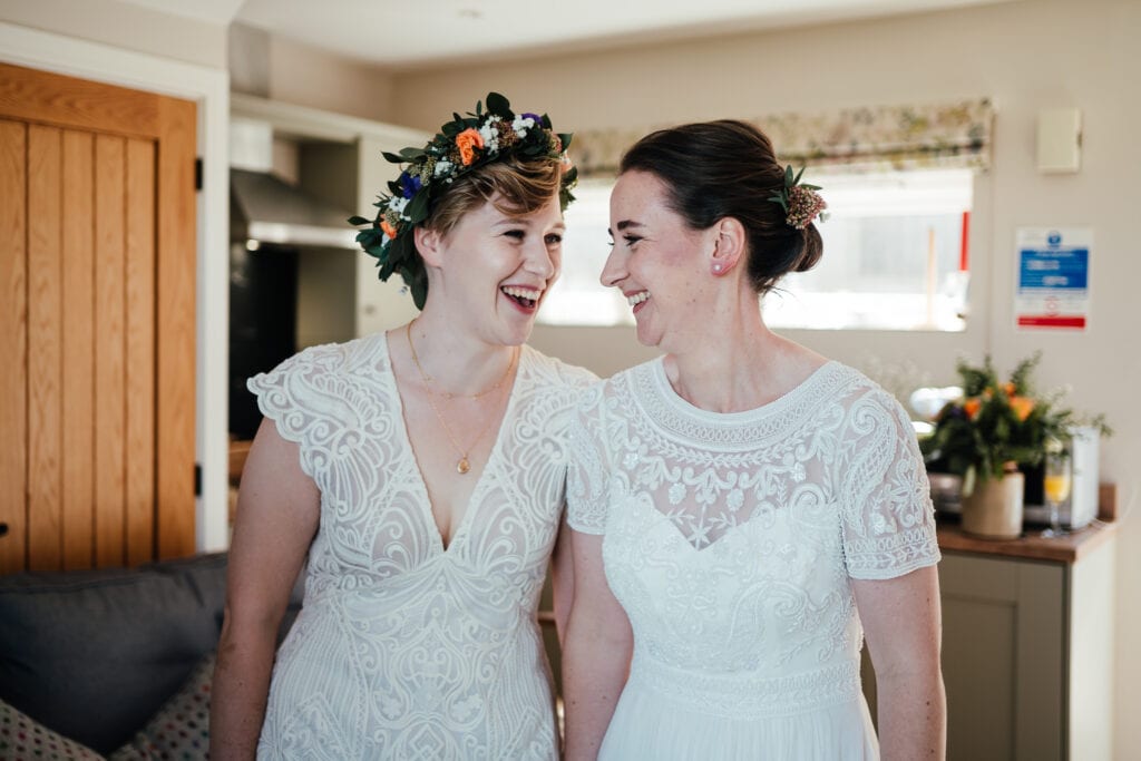 Brides laughing together