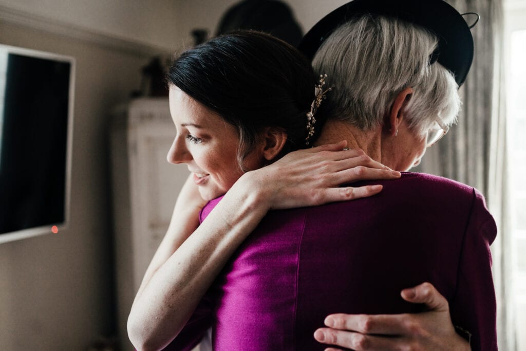 Bride embraces mum