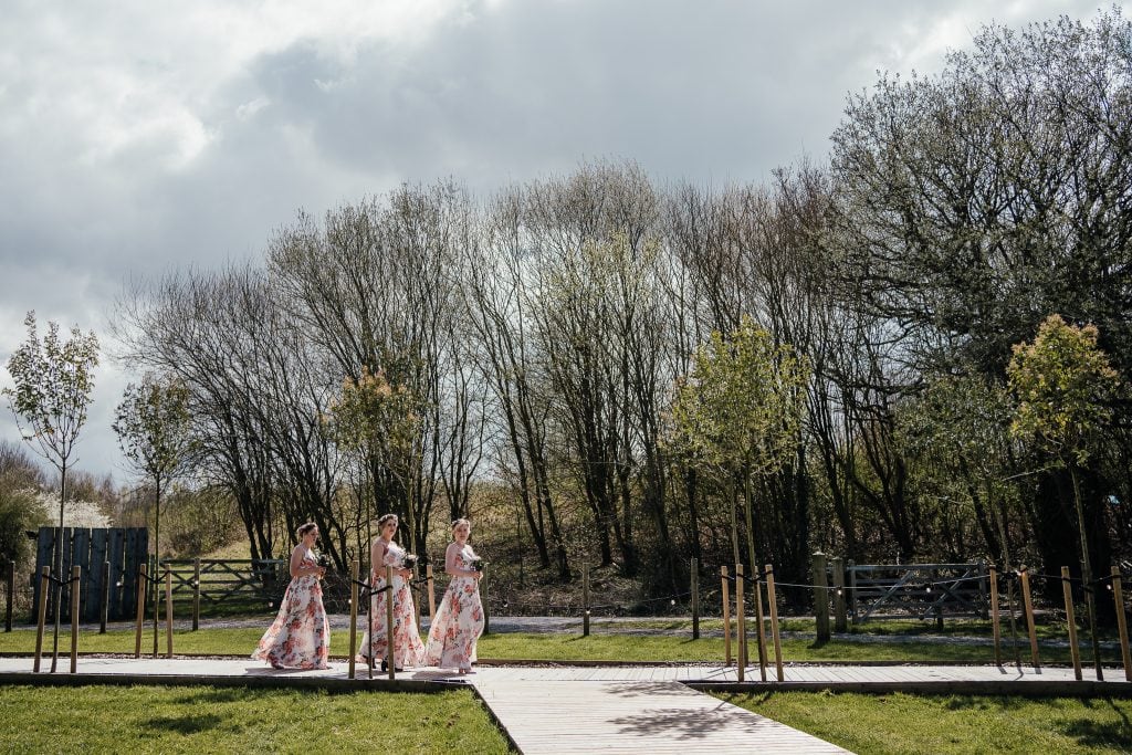 Bridesmaids walk unto The Hidden Hive