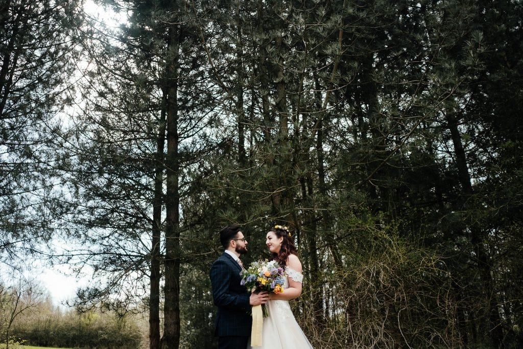 Bride and groom portrait in the forest at The Hidden Hive