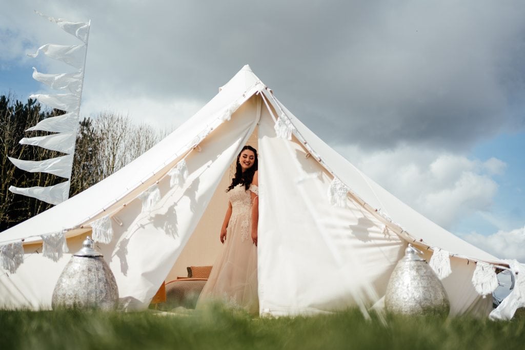 Bride getting ready in Bell tent at The Hidden Hive