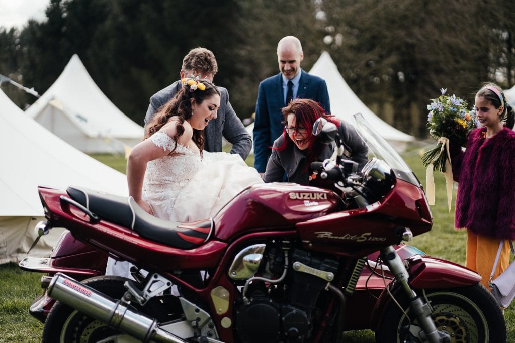 Bride getting into her dad's side car