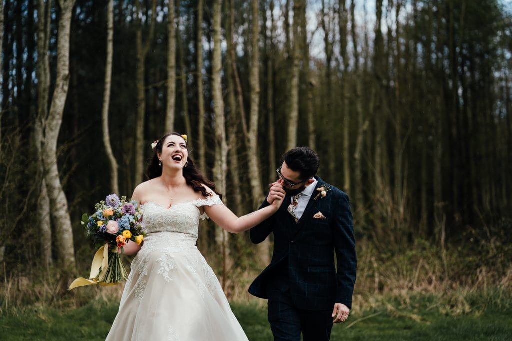 bride and groom in the rain at The Hidden Hive