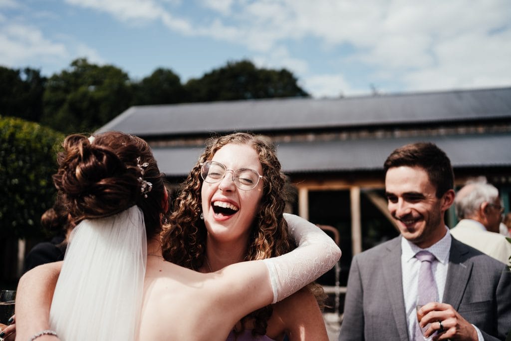 Bride hugs a guest