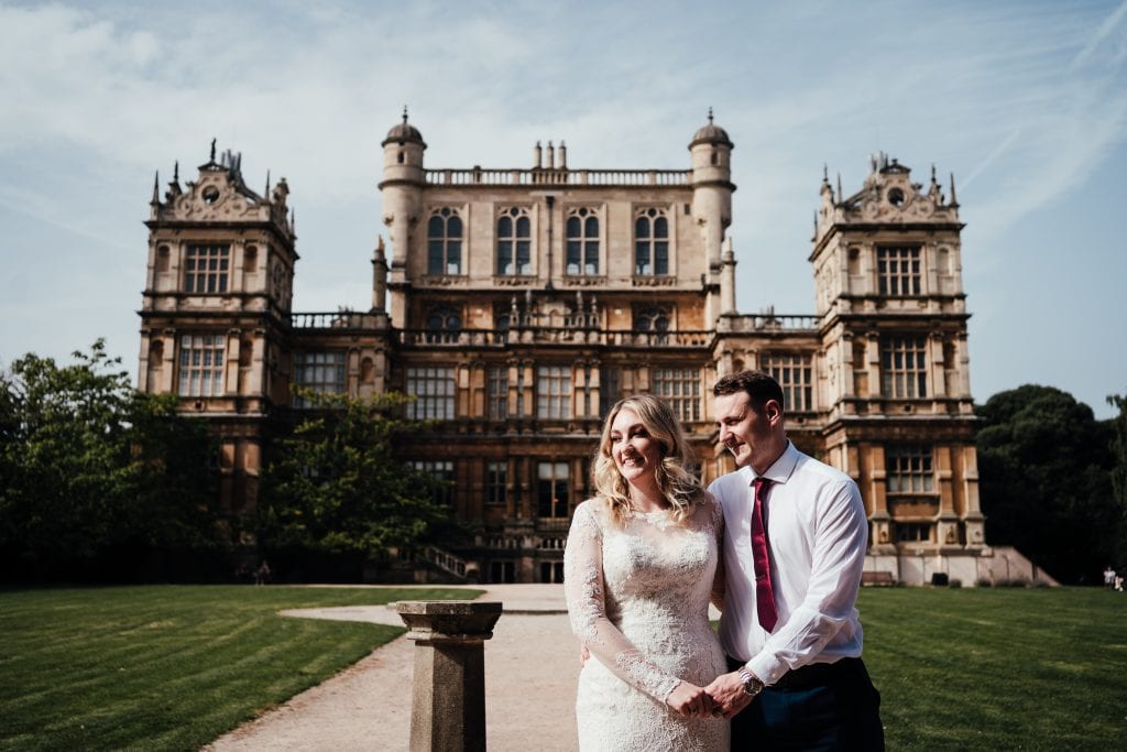 Bride and groom in front of Wollaton Hall