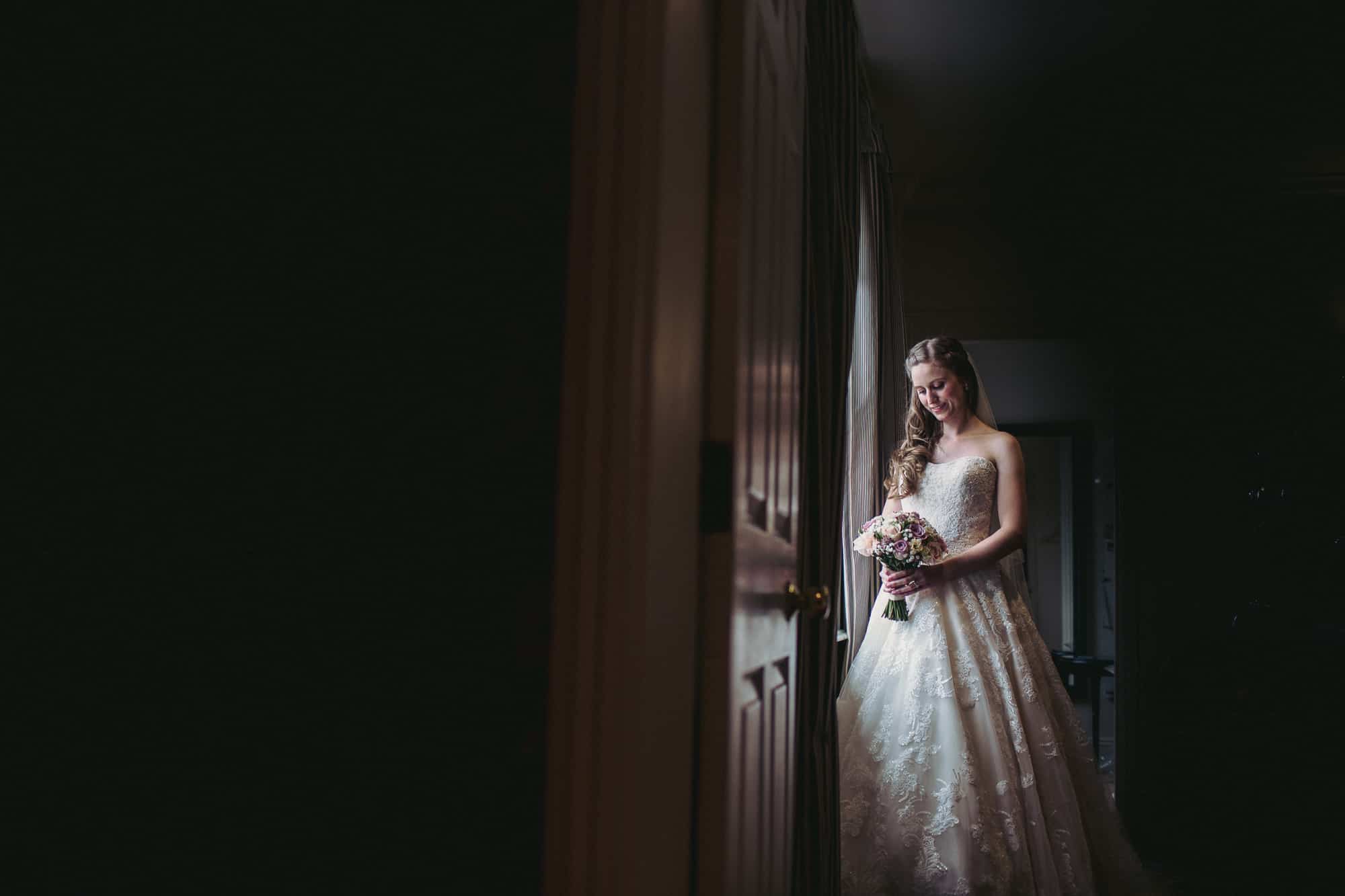 wedding at Langar Hall - bridal portraits in the window
