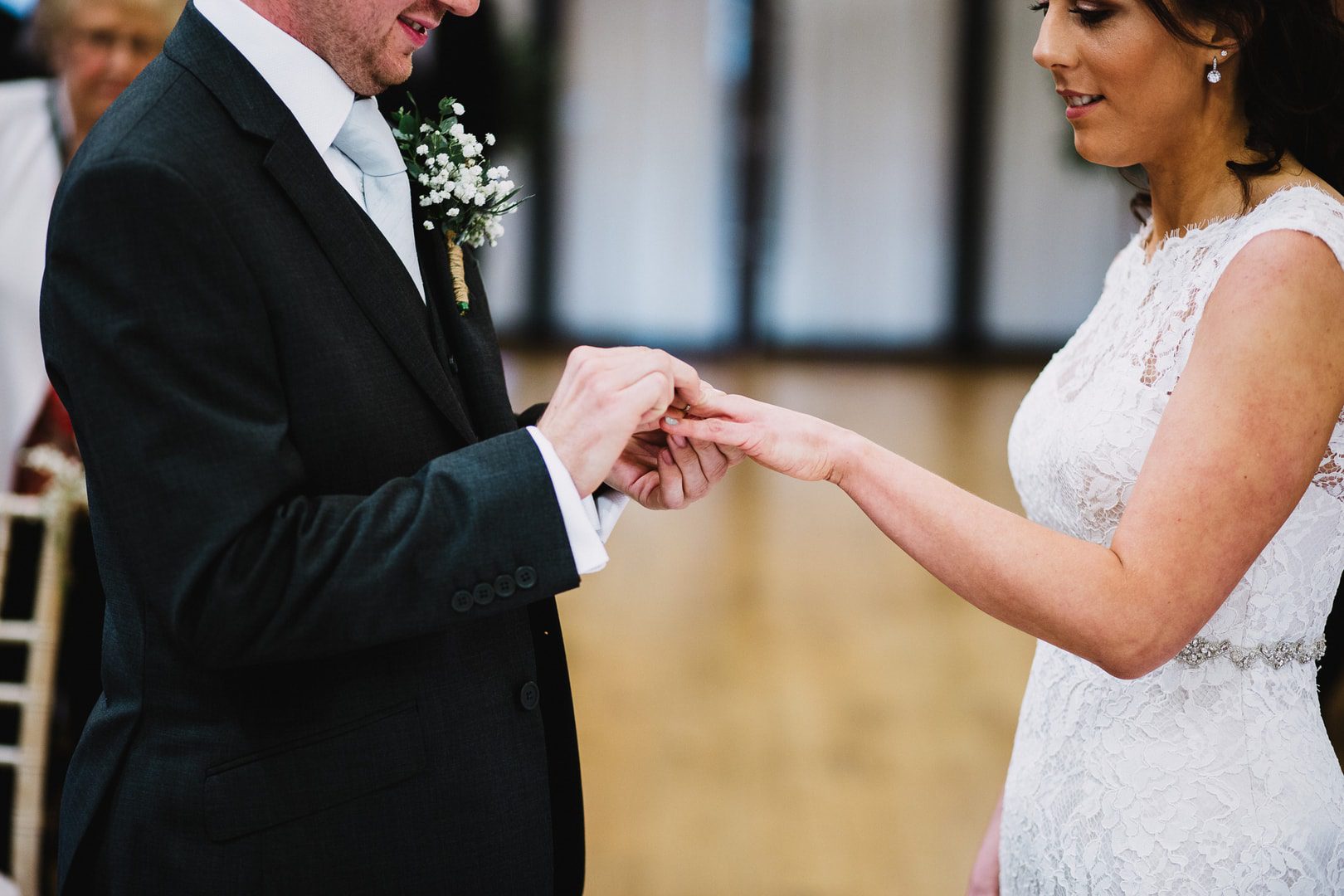 bride and groom exchange rings