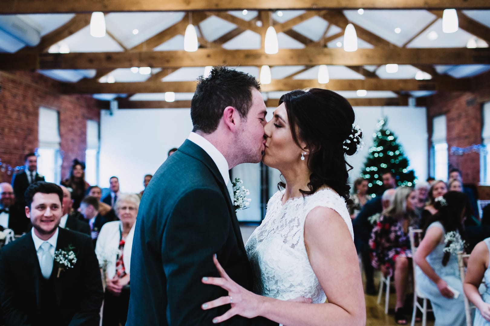 wedding photography at Rufford Mill - first kiss from front