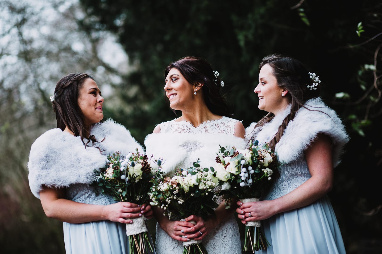 wedding photography at Rufford Mill - bride and bridesmaids in fur shoals