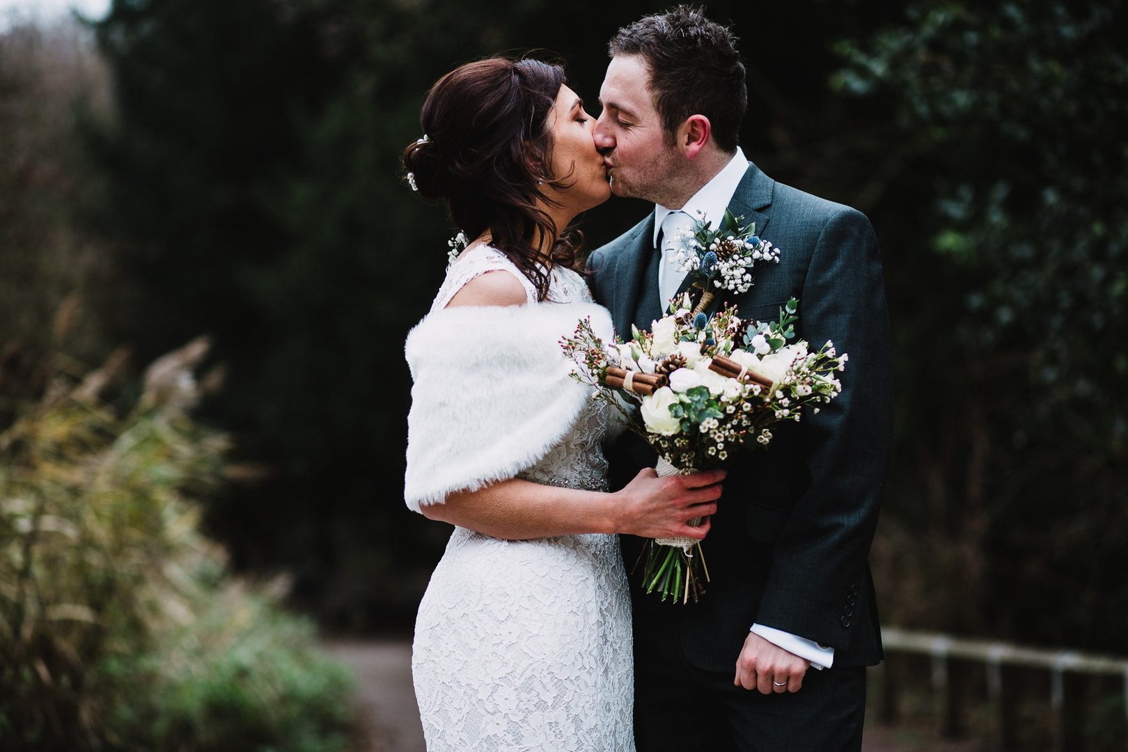 wedding photography at Rufford Mill - portrait outside bride and groom kiss