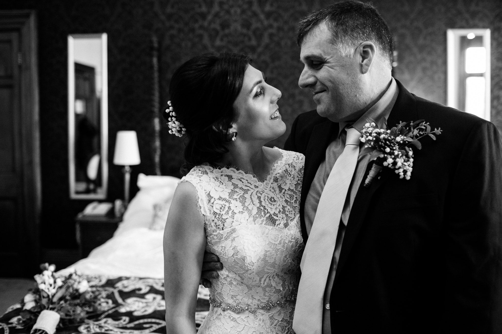 bride and father exchange a moment