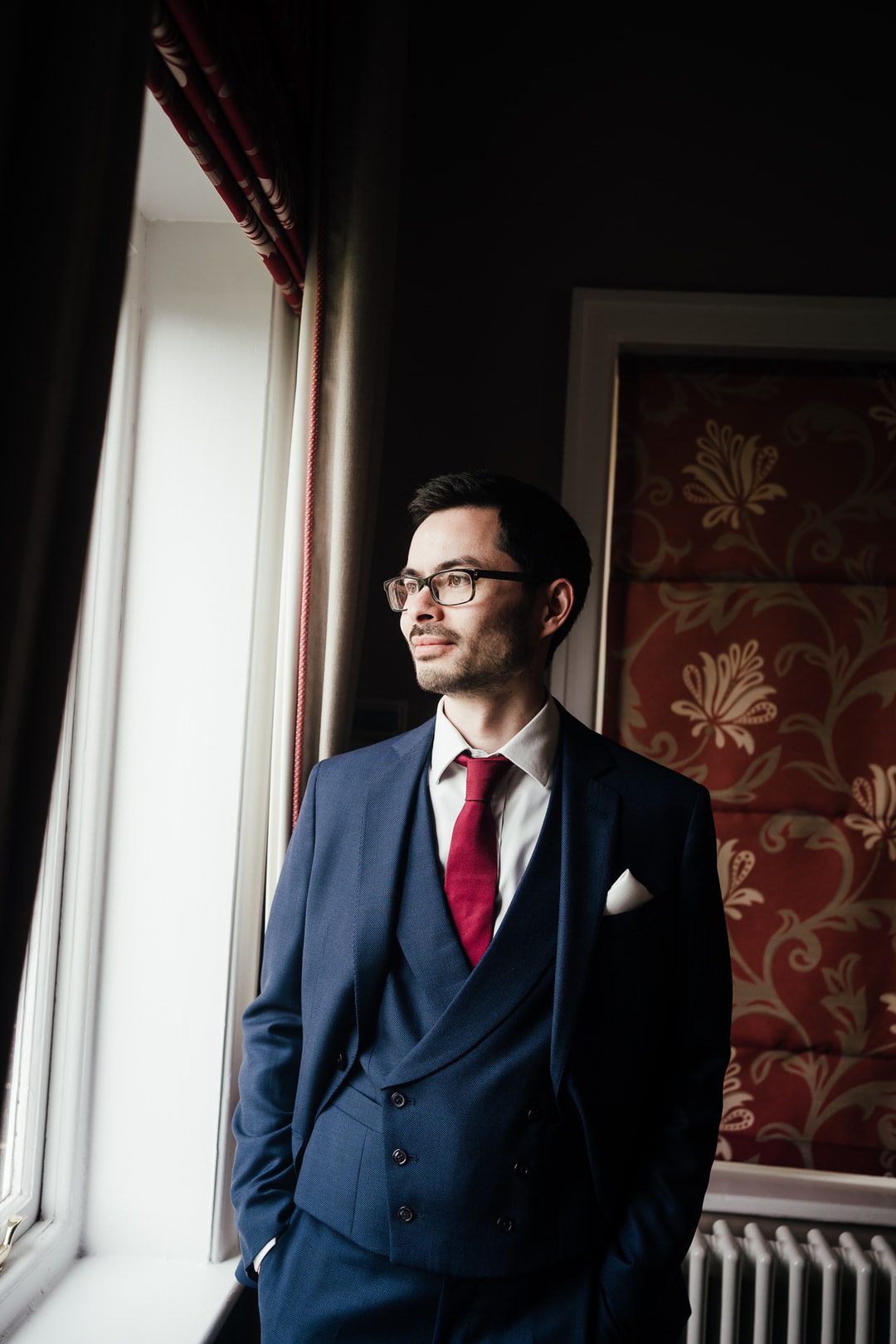 Wedding at West Bridgford Registry Office: Portraits of groom in the window light