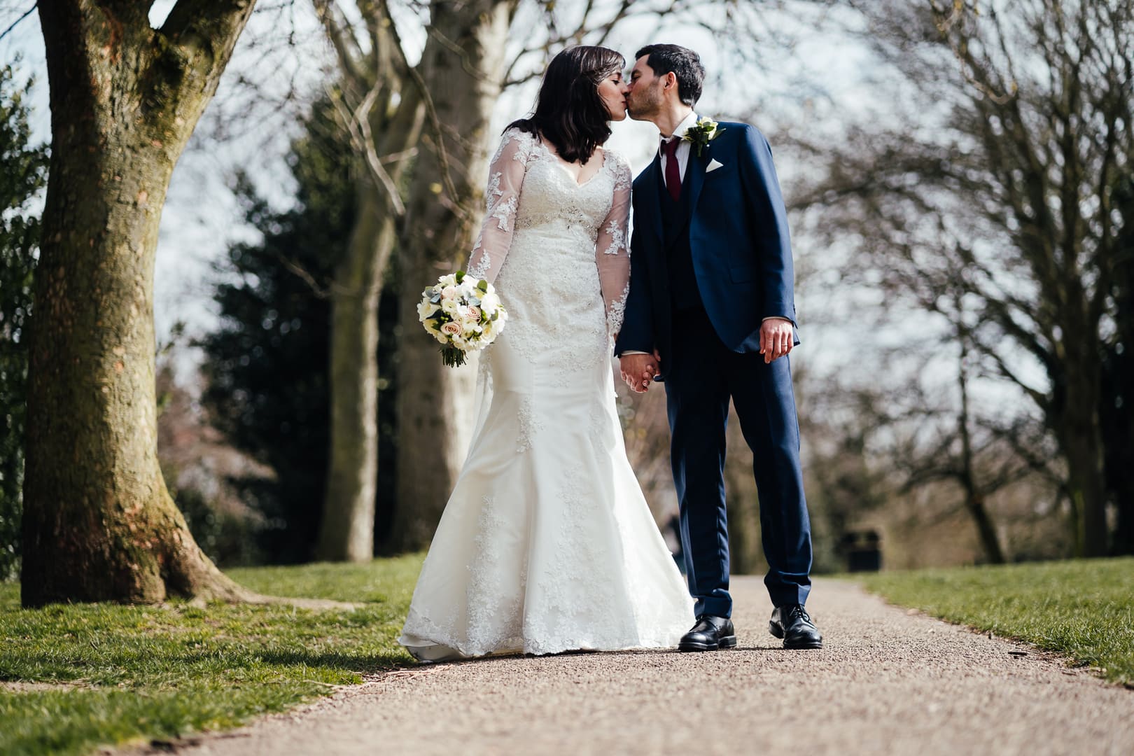 Wedding at West Bridgford Registry Office: Couple portrait in the park. Kissing