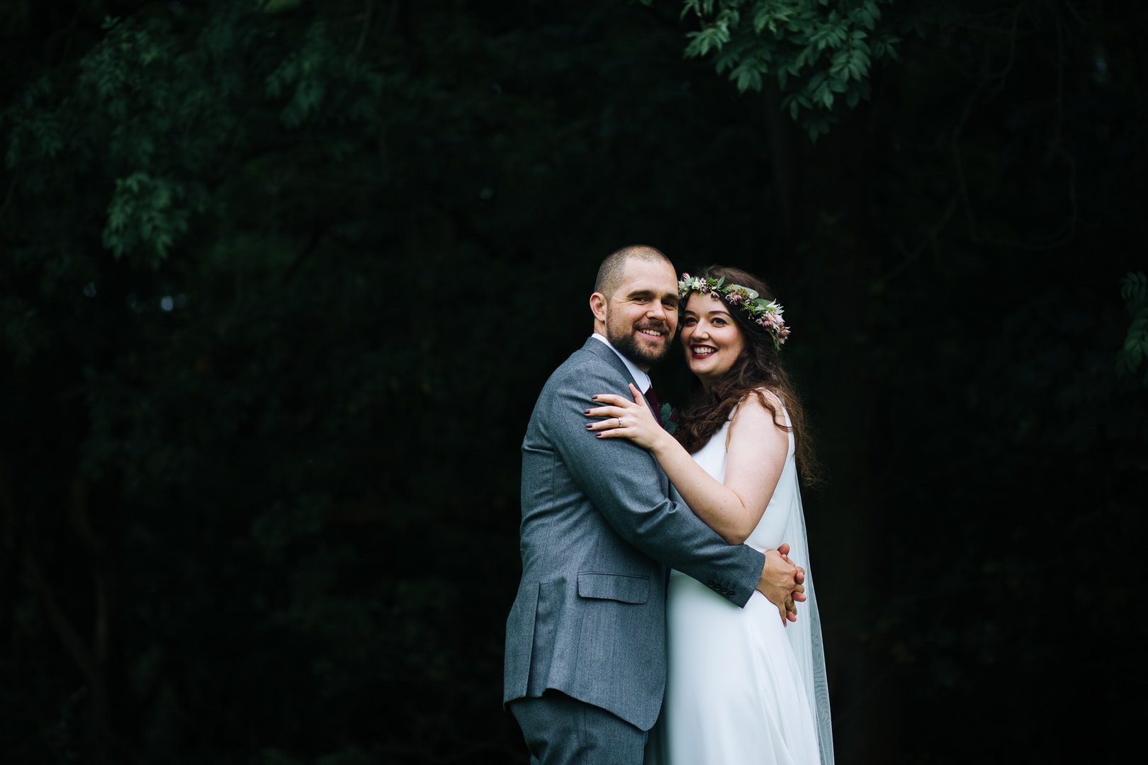 Barn weddings in Nottingham - bride and groom embrace for a portrait the grounds at Hazel Gap Barn