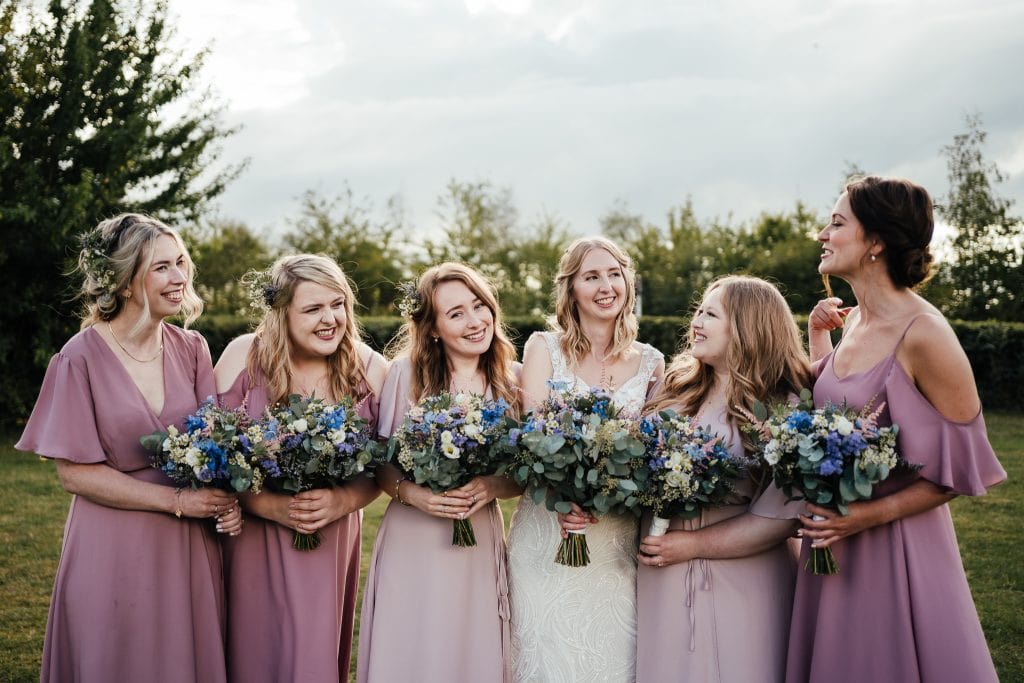 Bride and bridesmaids laughing at The Manor House Quorn