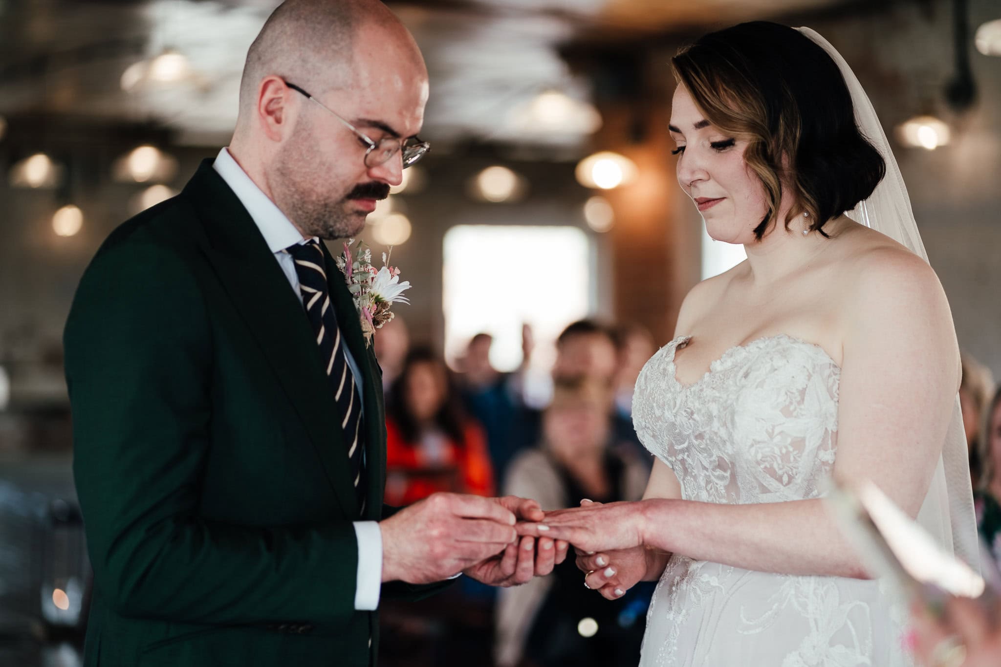 bride and groom exchange rings