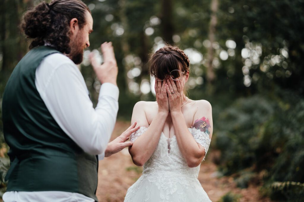 Bride covers her eyes overcome with emotion