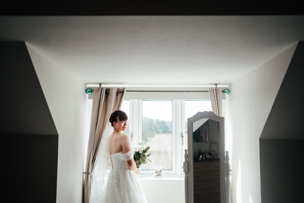Bridal portrait in window at home