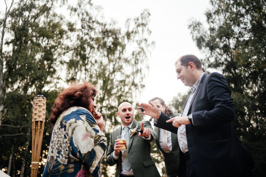guests in awe at magician at the wedding